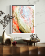 Becoming Bloom is heavily textured abstract painting in a white wood frame in a modern home
