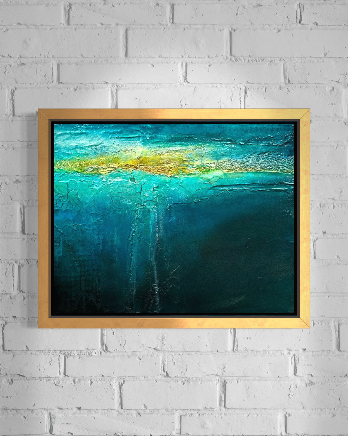 Beneath mixed media ocean abstract painting in gold frame by artist Jen Muse