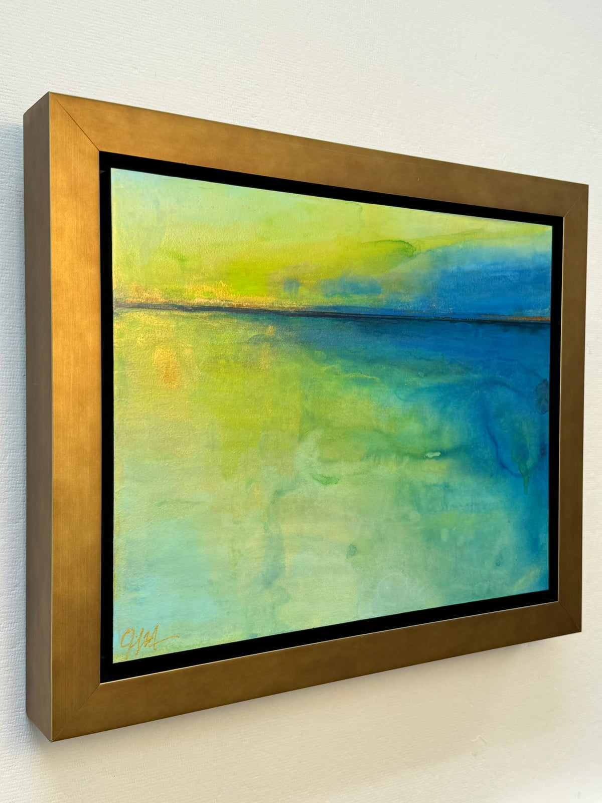 A gorgeous green and royal blue water painting inspired by the freshwater of michigan and floating on the water