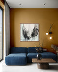 Soaring charcoal abstract painting displayed in a modern living room
