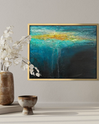 Beneath mixed media textured ocean abstract painting in gold frame by artist Jen Muse
