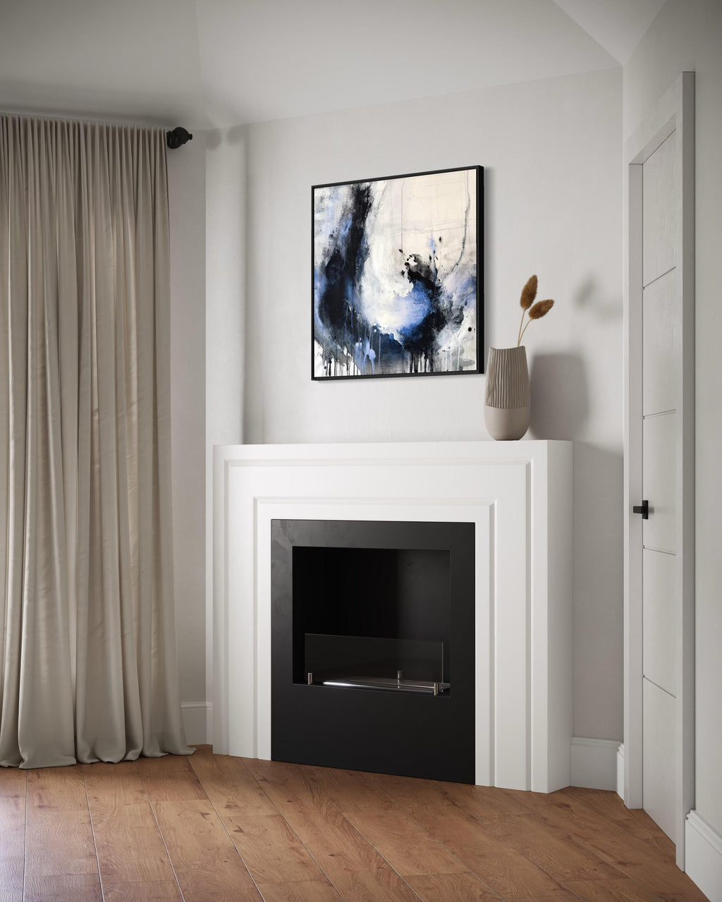Enduring charcoal abstract painting above a fire place in a white modern living room