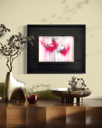 Abstract pink floral painting with modern black frame in dining room