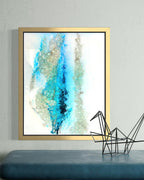 Mixed media artwork with kiln-formed recycled glass and aqua blue textures inspired by arctic landscapes in vertical gold frame 