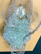 Detail2 of kiln-formed recycled glass and wire mesh texture in wall sculpture by Jen Muse