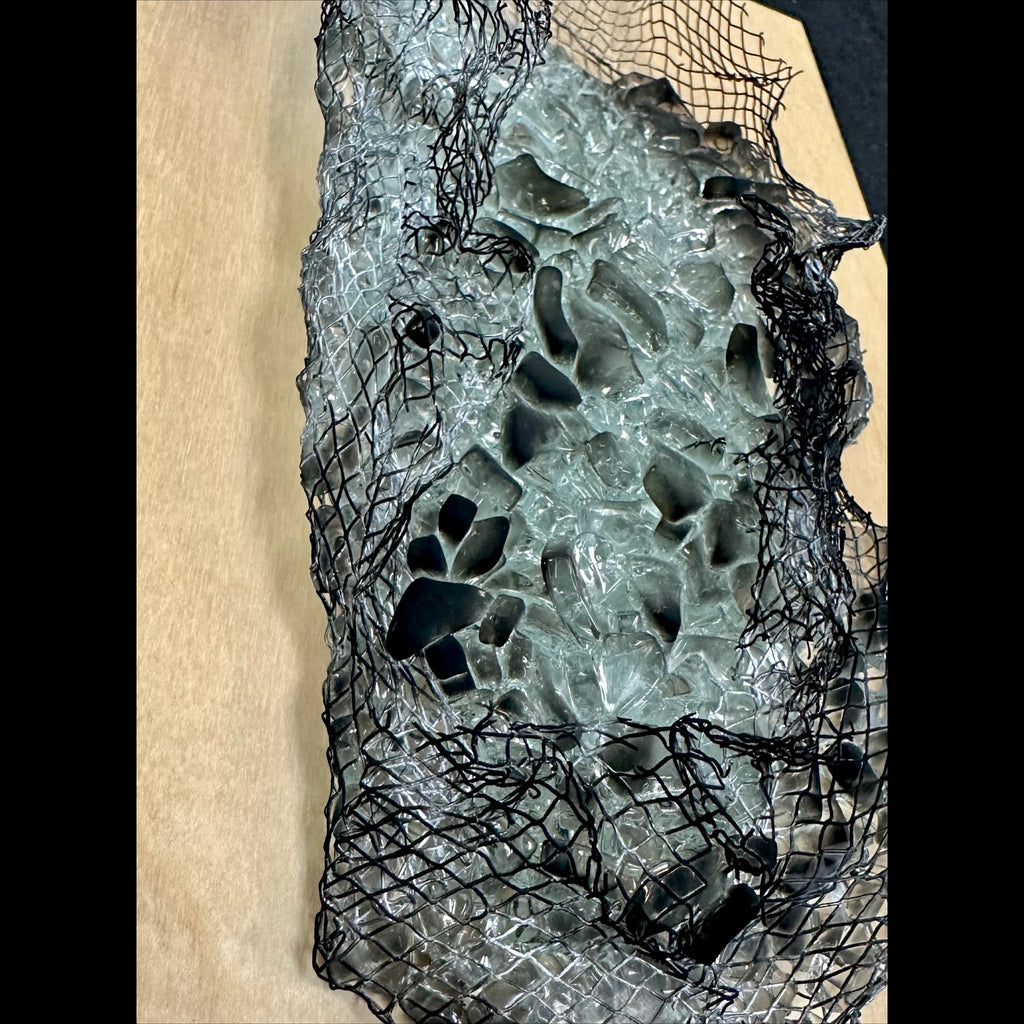 Kiln-formed glass wall sculpture with flame-finished maple backing details
