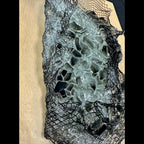 Kiln-formed glass wall sculpture with flame-finished maple backing details
