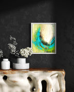 mixed media ocean inspired artwork with aqua blues and greens shown in a modern dining room