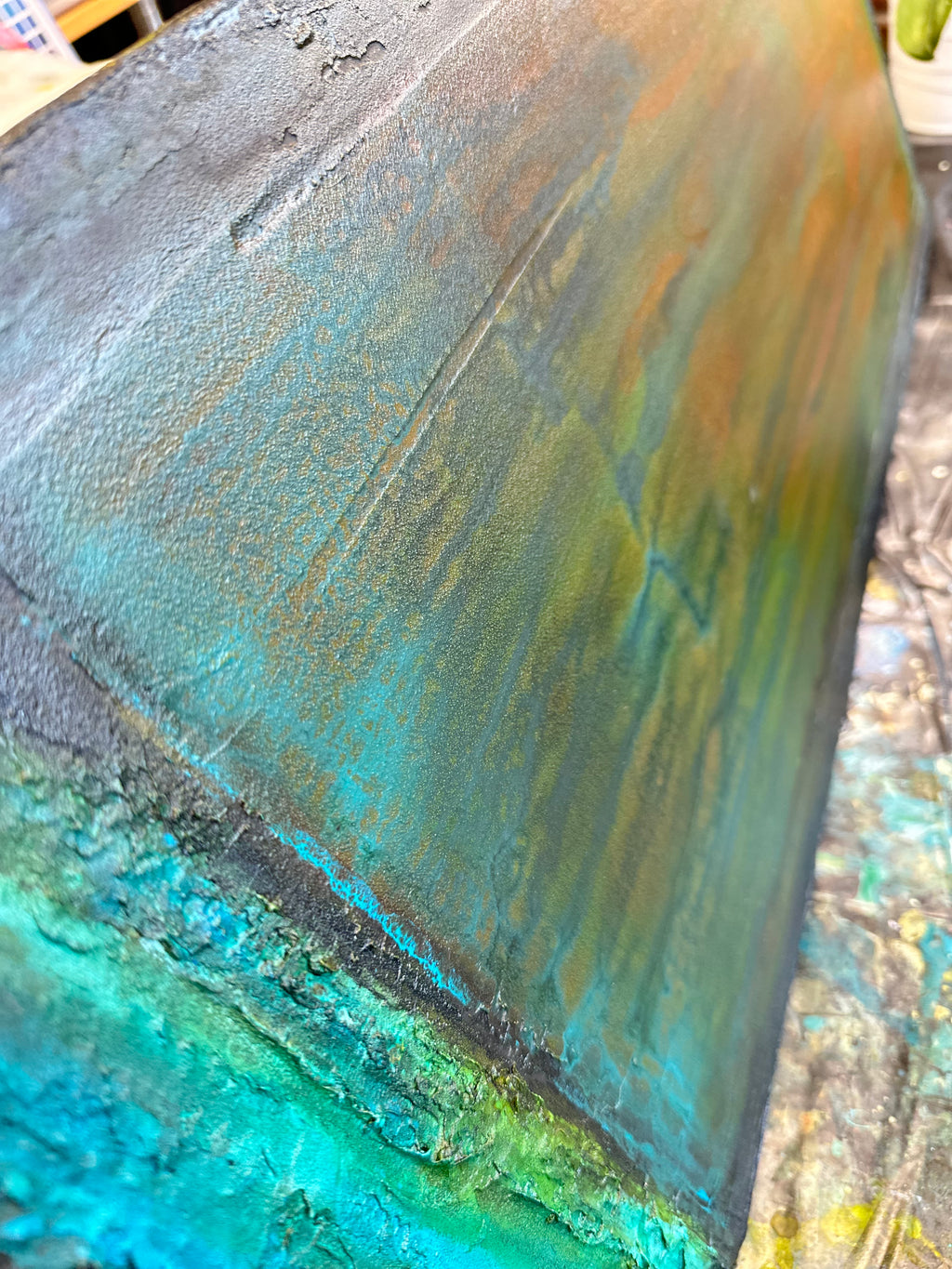 Up close aged copper like paint textures in Mind Matter Spirit by artist Jen Muse