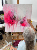 Jen Muse with Pink Evanescence abstract artwork in her studio